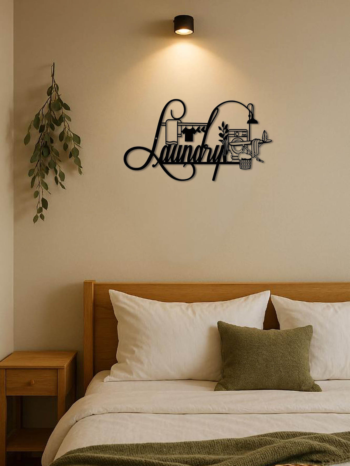 Wall art with 'Laundry' design above a bed in a bedroom.