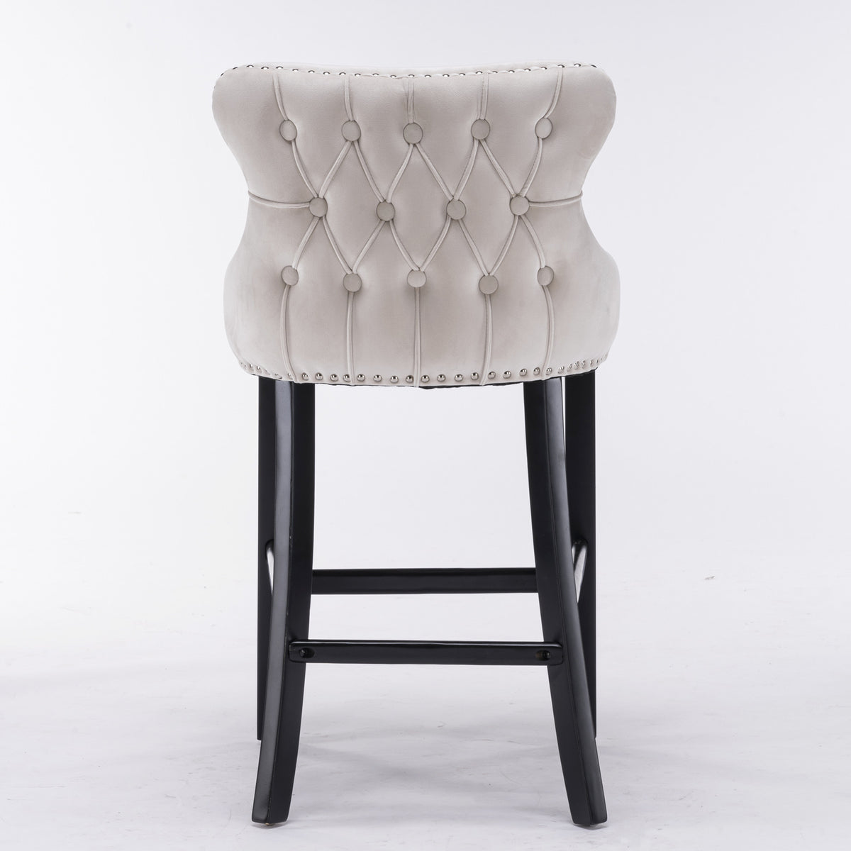 Bar stool with tufted gray cushion and black legs on a white background