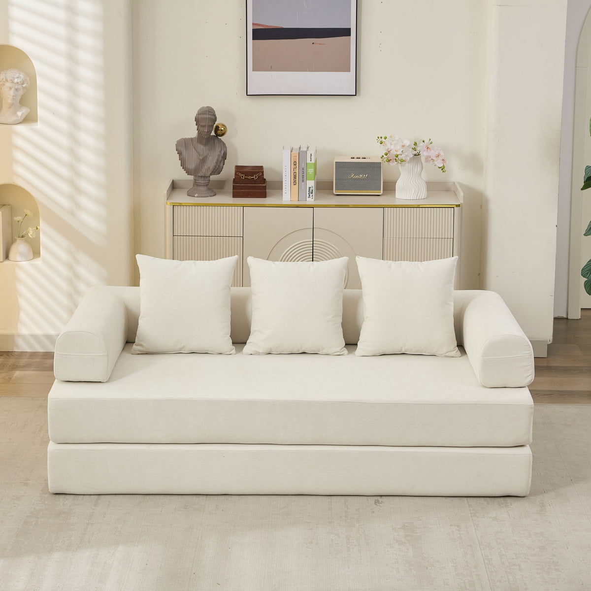 White sofa with decorative pillows in a modern living room setting.