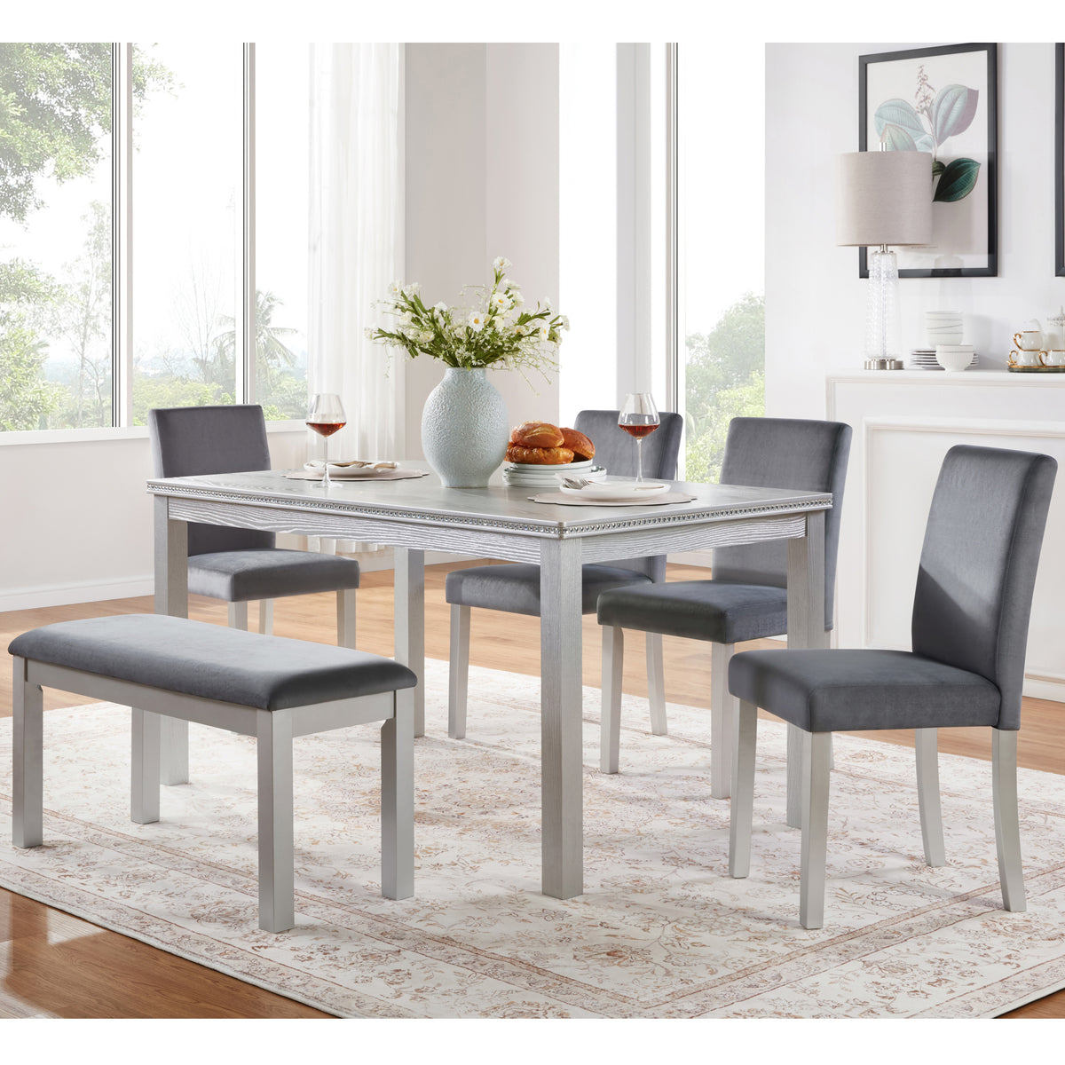 Dining room set with a table and chairs in a well-lit room.