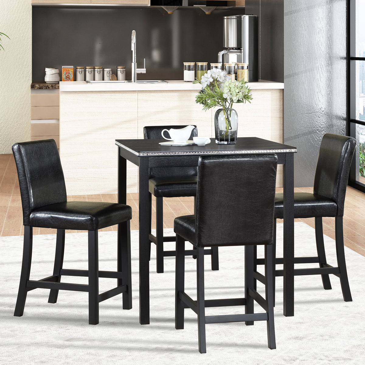 Black dining set with table and chairs in a kitchen setting