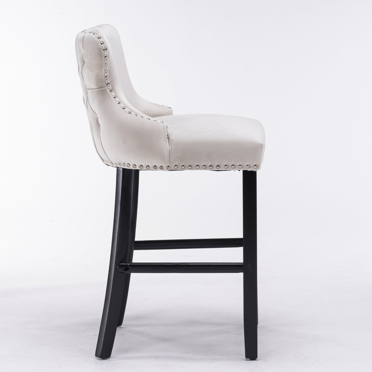 Gray cushioned bar stool with black legs on a white background