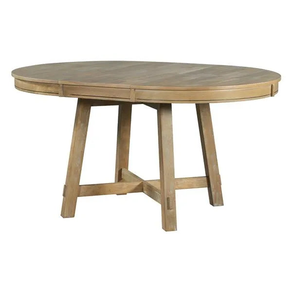 Round wooden dining table on a white background